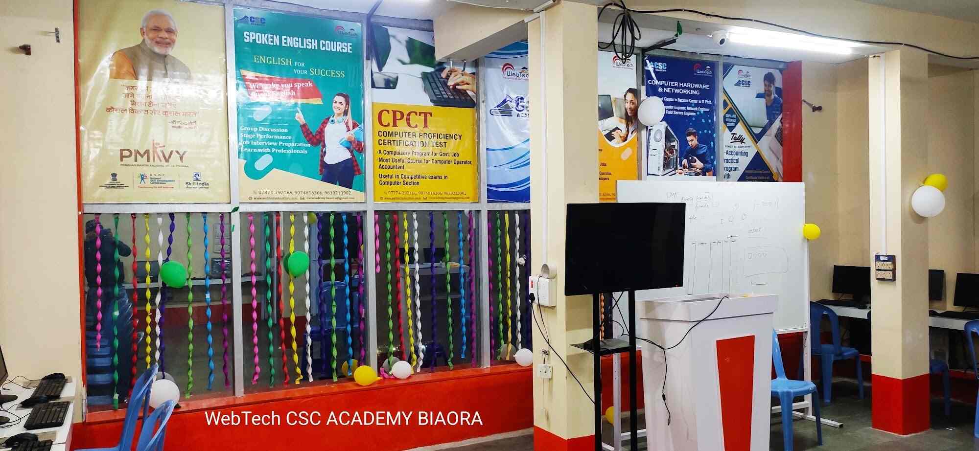 Students in a rural classroom with laptops