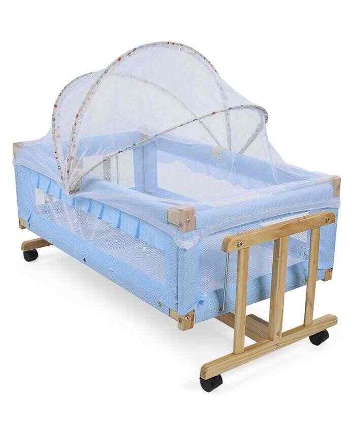 wooden cradle with mosquito net